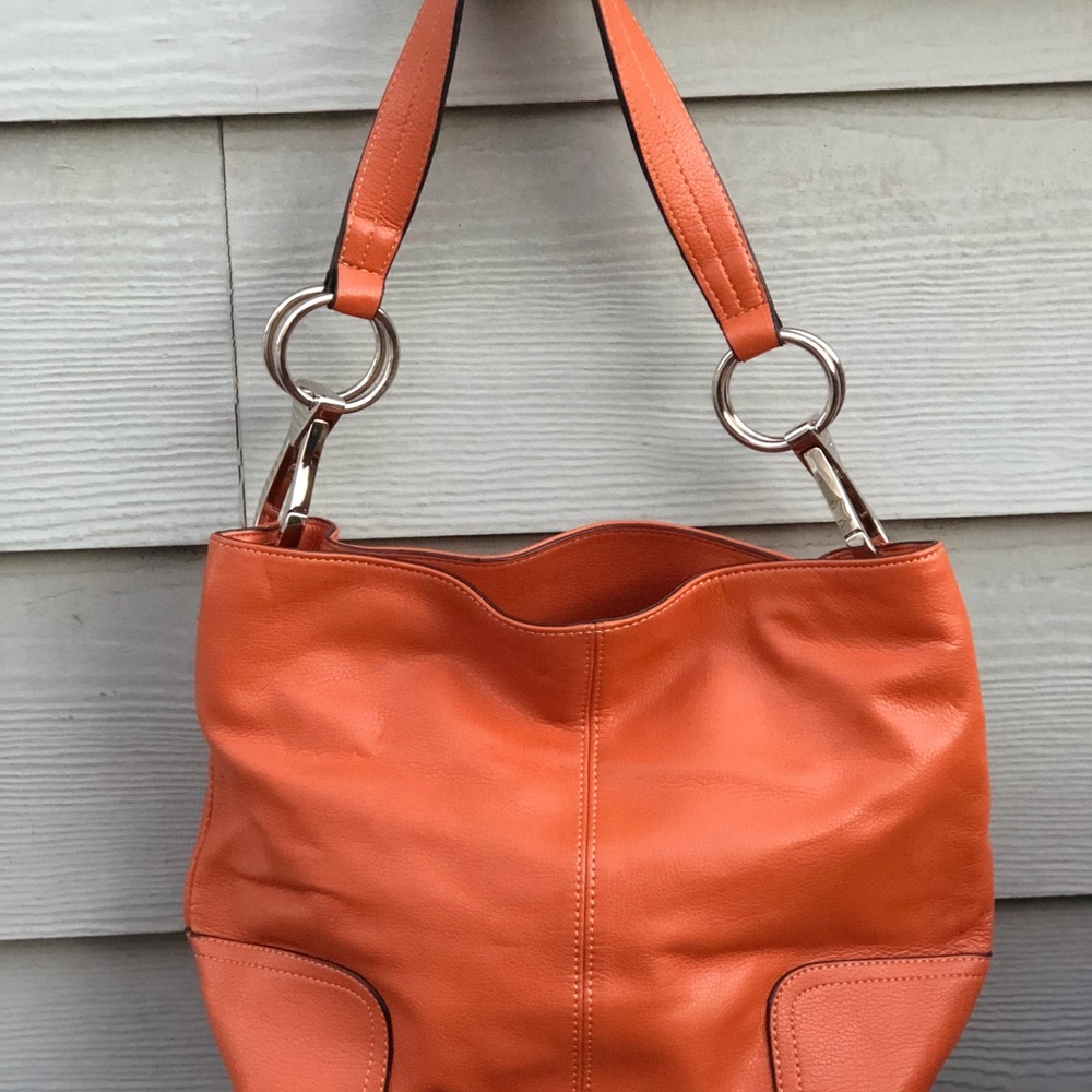 Orange colored handbag